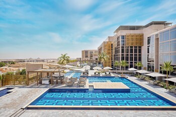 Relax and socialize in our spacious courtyard, featuring a comfortable seating area and bar.
