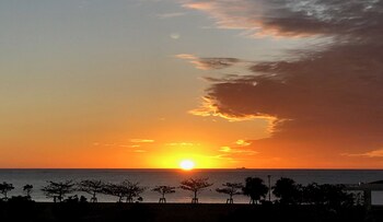 Indoor pool, seasonal outdoor pool, open 9 AM to 9 PM, pool umbrellas