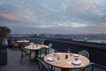 Breakfast, lunch, dinner served; al fresco dining 