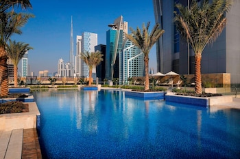 Outdoor pool, open 7:00 AM to 9:00 PM, pool umbrellas, pool loungers