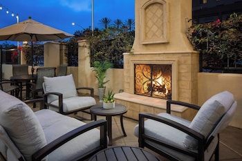 Outdoor pool, open 7:00 AM to 10:00 PM, pool umbrellas, pool loungers