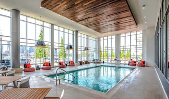 Indoor pool, pool umbrellas, pool loungers