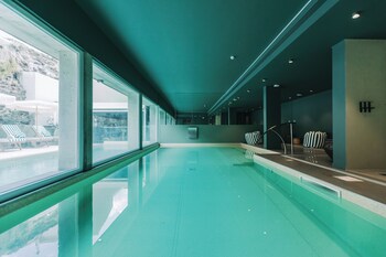 Indoor pool, outdoor pool, open 10:00 AM to 8:00 PM, pool umbrellas