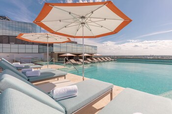 Outdoor pool, open 8:00 AM to 8:00 PM, sun loungers