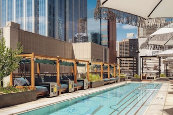 Outdoor pool, open 6:00 AM to 8:00 PM, pool cabanas (surcharge)