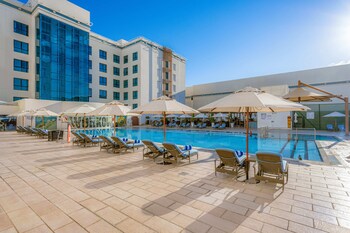 Outdoor pool, open 6:00 AM to 10:00 PM, pool umbrellas, pool loungers