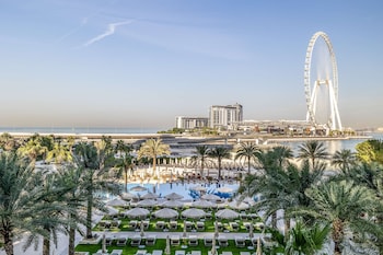 2 outdoor pools, open 9 AM to 9 PM, pool umbrellas, pool loungers