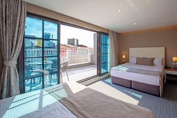 Quadruple Room, Balcony | Minibar, in-room safe, blackout drapes, soundproofing