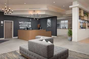 Executive Suite, 1 King Bed, Balcony | Desk, laptop workspace, blackout drapes, iron/ironing board