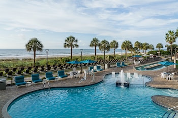 Outdoor pool, open 7:00 AM to 11:00 PM, pool umbrellas, sun loungers
