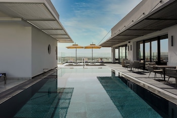 Outdoor pool, open 10:00 AM to 6:00 PM, pool umbrellas, pool loungers