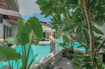 2 outdoor pools, open 7:00 AM to 9:00 PM, pool umbrellas, pool loungers