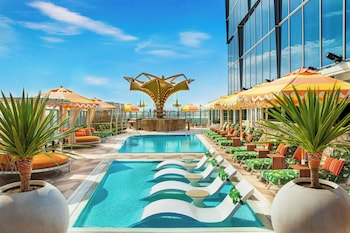 Experience the welcoming atmosphere of our outdoor space, featuring comfortable seating areas and string lights.