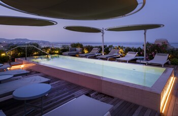 Stunning historic and modern architecture set against a serene waterfront backdrop.