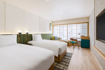 Deluxe Room, 2 Twin Beds | Down comforters, in-room safe, desk, laptop workspace