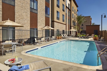 Outdoor pool, open 8:00 AM to 10:00 PM, pool umbrellas, pool loungers