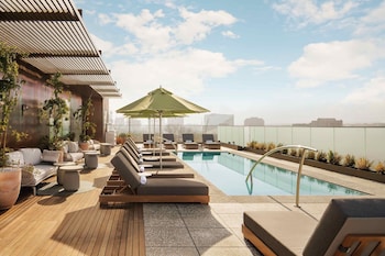 Outdoor pool, pool umbrellas, sun loungers