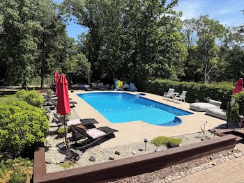 Seasonal outdoor pool, pool umbrellas, pool loungers