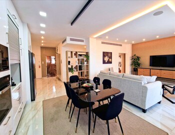 Superior Apartment | Living area | 43-inch Smart TV with satellite channels, TV