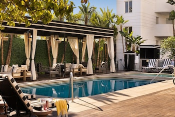 Outdoor pool, open 8:00 AM to 10:00 PM, cabanas (surcharge)