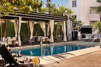 Outdoor pool, open 8:00 AM to 10:00 PM, cabanas (surcharge)