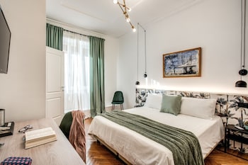 Contemporary space with a large, circular metal structure and a clean, minimalist design.