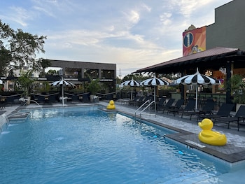 Outdoor pool, open 8:00 AM to 9:00 PM, pool cabanas (surcharge)
