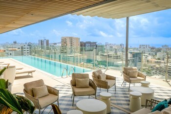 Relax by the pool and take in the city views.
