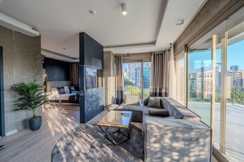 Deluxe Suite | Premium bedding, minibar, desk, laptop workspace