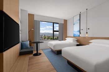 Room, 1 King Bed | Bathroom | Shower, rainfall showerhead, slippers, towels