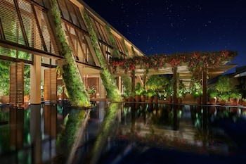 On the beach, white sand, beach cabanas, sun loungers