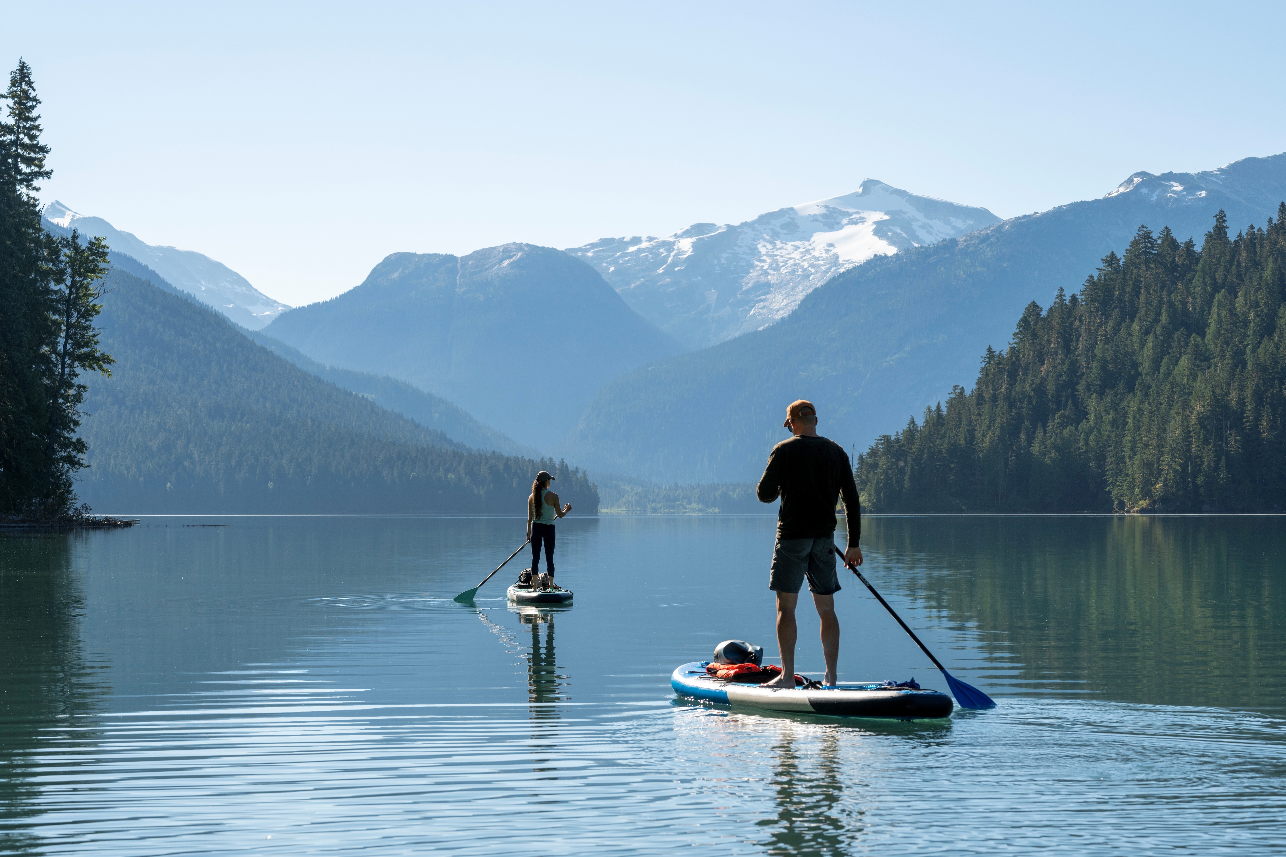 Man paddling on lake