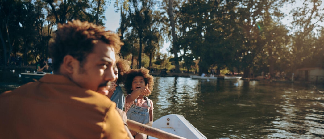 Family enjoying the boating lake in Rome's Villa Borghese gardens