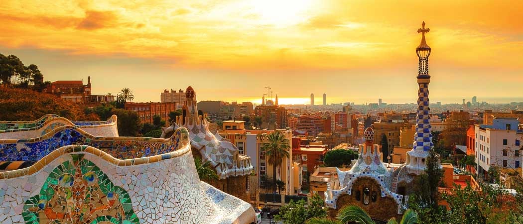 Rooftop view of Barcelona, Spain skyline at dawn.