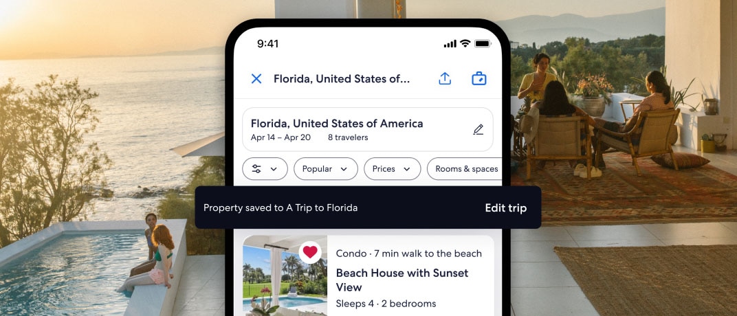 An iPhone screen showing a saved property in the trip planning tool, with a beach scene in the background
