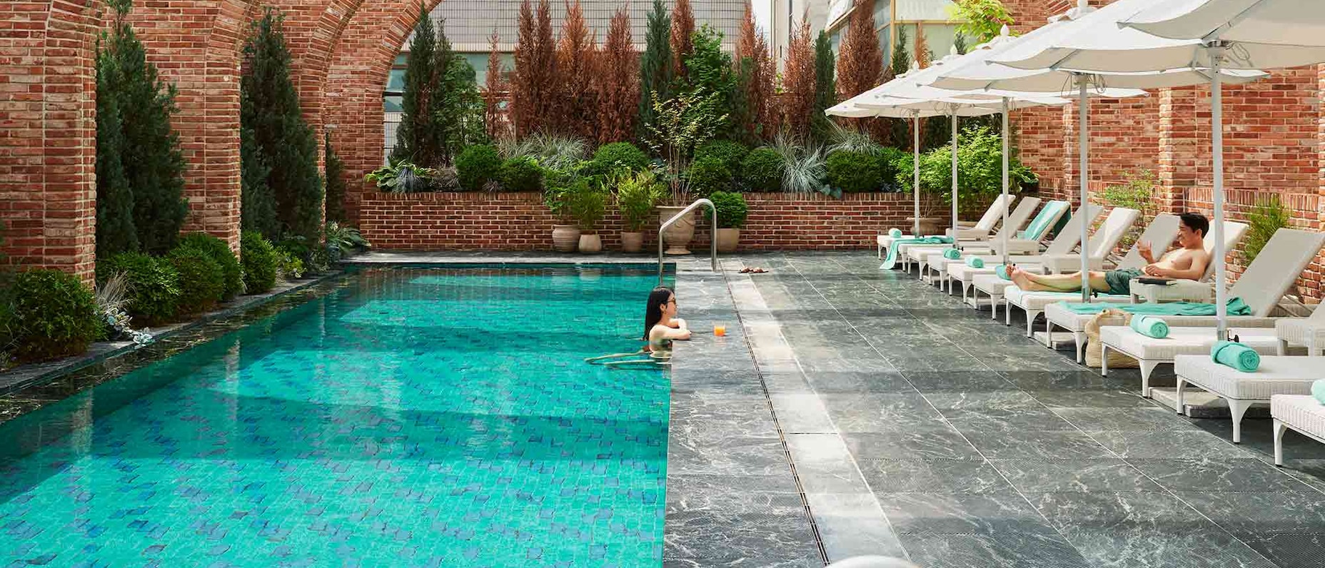 A traveler relaxes in the swimming pool at the Ananti at Gangnam hotel in Seoul, South Korea.
