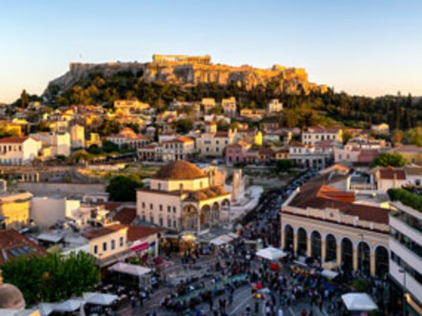 A view of Acropolis of Athens in Greece with a bustling city centerof visitors below