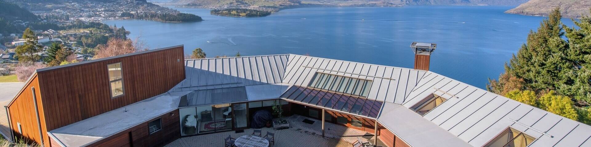 A cosy interior with mismatched armchairs and far-reaching views over the water