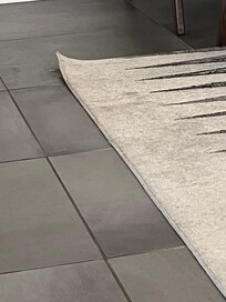 The dirty curled rugs