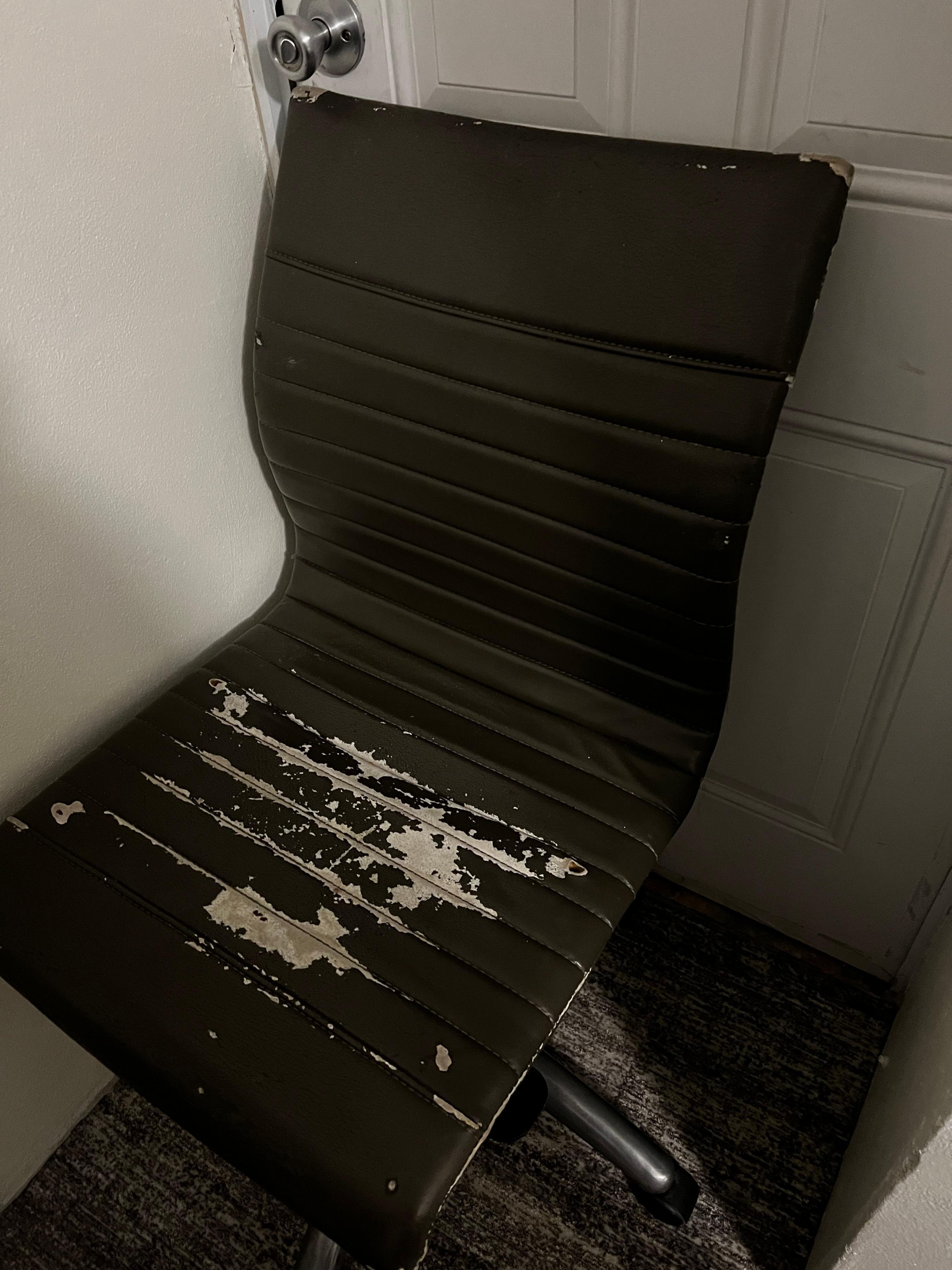 Disgusting worn out computer chair.