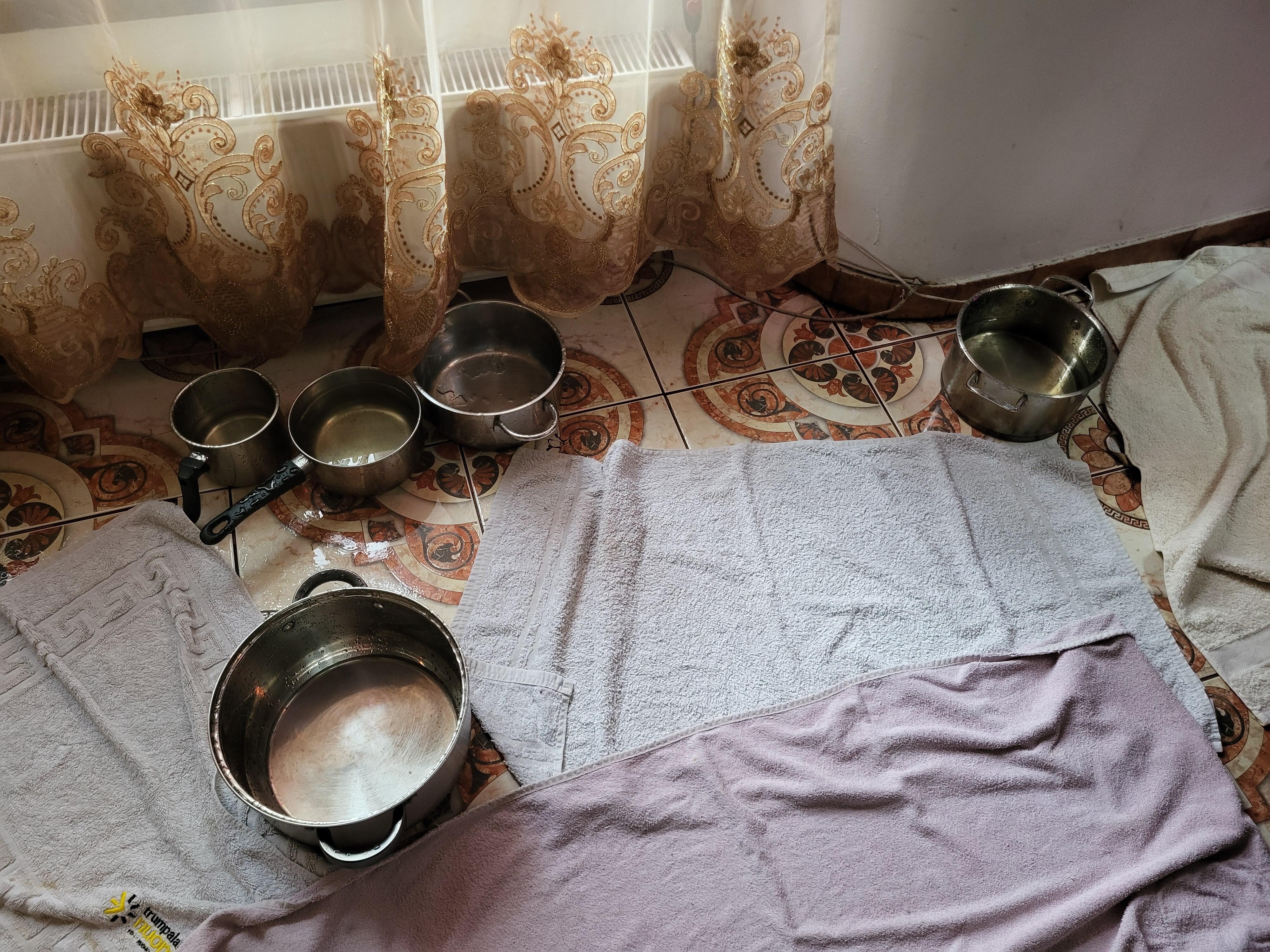 pots + towels to deal with the water in living room