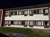 Building needs painted I thought it was closed down.So dark I thought somebody could attack me in the parking lot