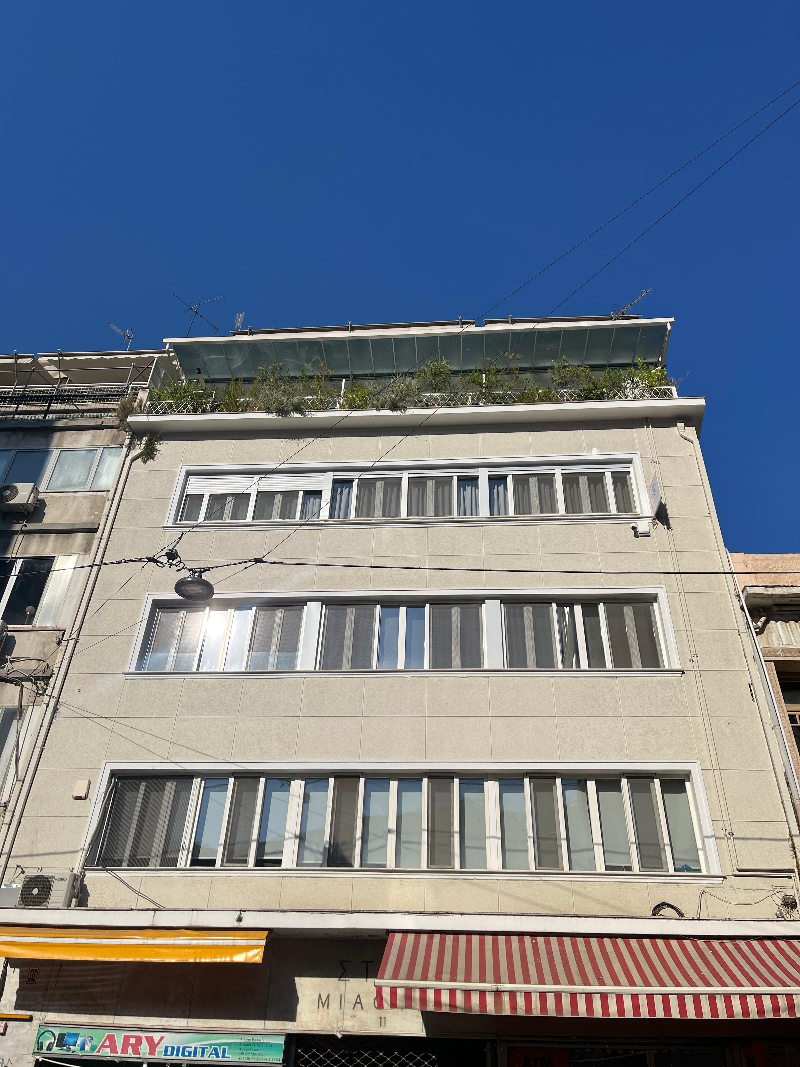 Outside of the building looking up to the 4th floor balconies