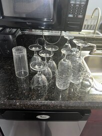 Dirty glassware covered in finger prints, mouth prints, and generally appearing as if they hadn’t been washed