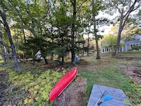Taken standing on the dock facing the house. The canoe is in great shape.