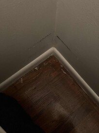 Broken glass in a bedroom.
