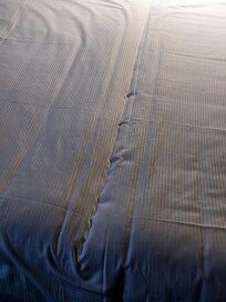 Two twin beds pushed toegther.