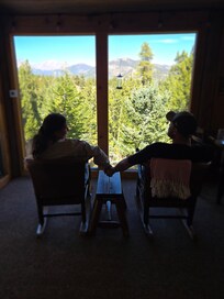 Our favorite spot, the warm, cozy cabin 4 seasons room with a view!