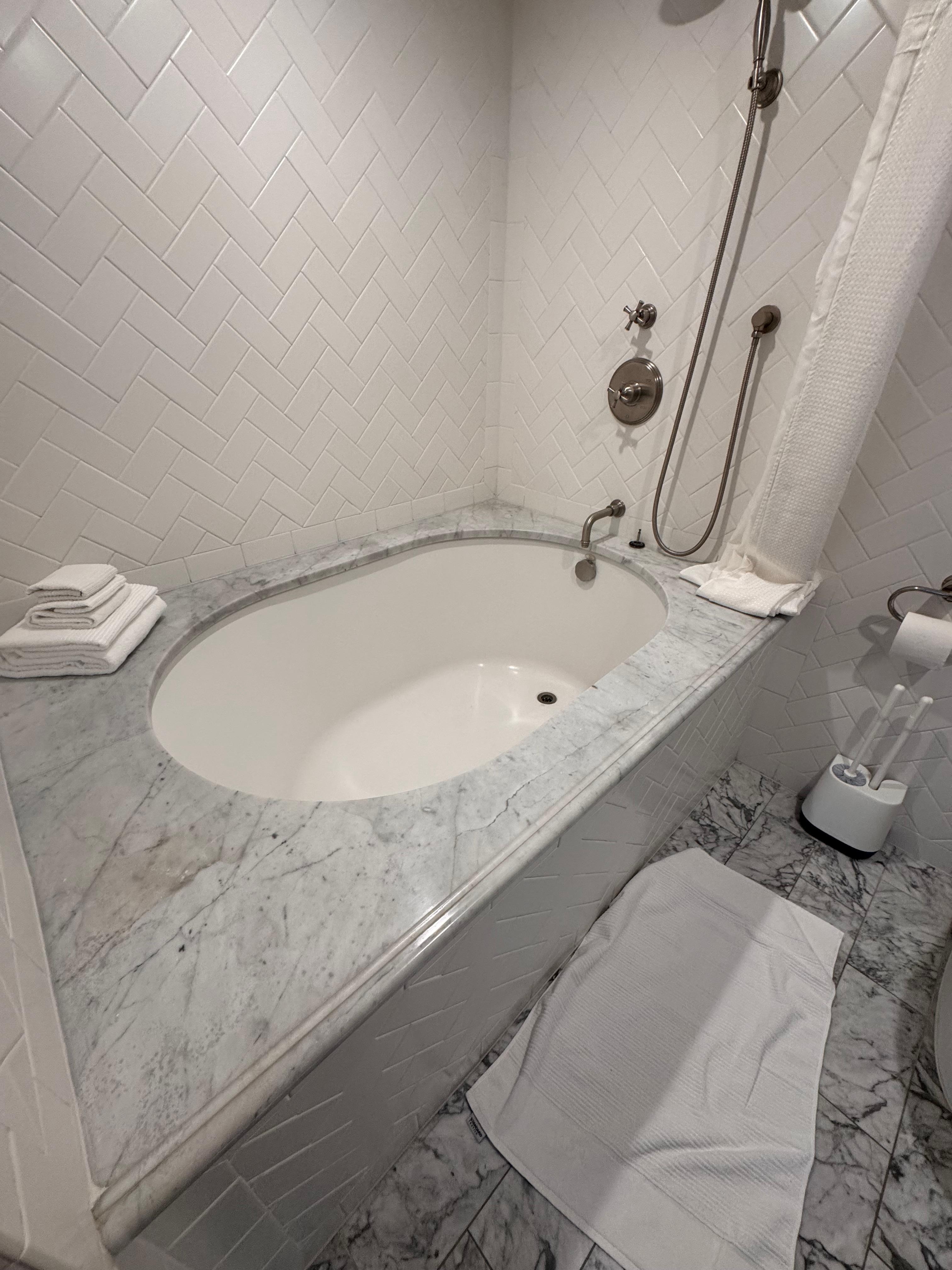 Not an easy step into show/tub. Sink faucet is below countertop level