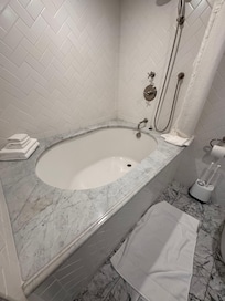Not an easy step into show/tub. Sink faucet is below countertop level